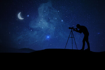 Astronomer looking at starry sky through telescope outdoors. Space for text