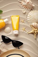 summer holiday accessories on the sandy beach. suntan lotion - 711352542