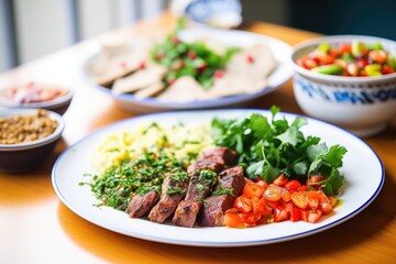 middle eastern kebab spread with hummus and tabbouleh