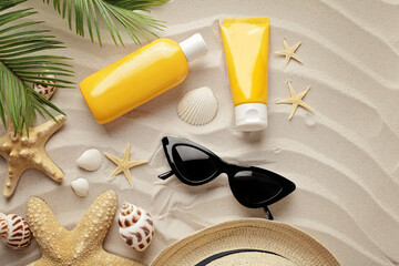 summer holiday accessories on the sandy beach. suntan lotion