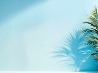 Fototapeta na wymiar Palm leaves on a light bluegreen background toned template for text panorama with copy space 