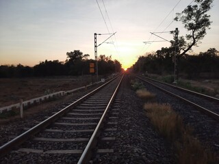 Fototapeta na wymiar railway in sunset. railway track over sunset.