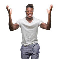 Young african american man over isolated background celebrating mad and crazy for success with arms raised and closed eyes screaming excited. Winner concept