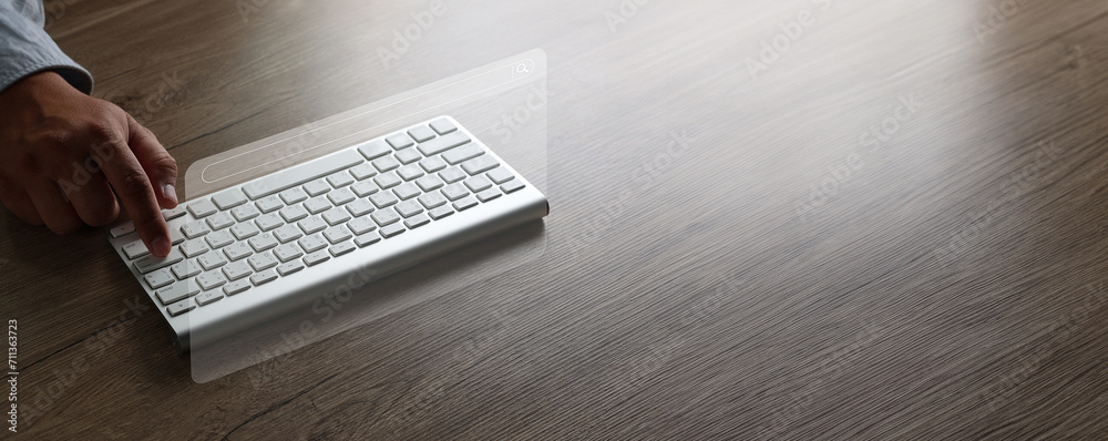 Poster man searching information is typing a keyboard technology search engine optimization on desk in offi