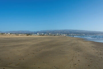 Sandy beach of Maspalomas with a view of the city on Gran Canaria, Spain
