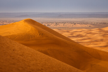 Fototapeta na wymiar Colorful desert dunes with beautiful background in Sahara, Merzouga, Morocco