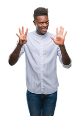 Young african american man over isolated background showing and pointing up with fingers number nine while smiling confident and happy.