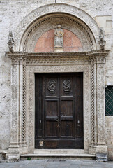 Intricate door of Palazzo del Capitano del Popolo in Perugia, Italy