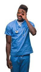 Young african american doctor man over isolated background wearing surgeon uniform doing ok gesture with hand smiling, eye looking through fingers with happy face.