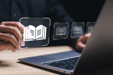 E-library concept. Person use laptop with virtual E-book icons for electronic books online, knowledge base on internet, digital library or e-library. - obrazy, fototapety, plakaty