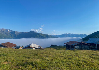 General landscape view of a Elevit plateau in Camlihemsin, Rize.  Plateau has a wide meadow area with excellent nature views and wooden chalets. Rize, Camlihemsin, Turkey.