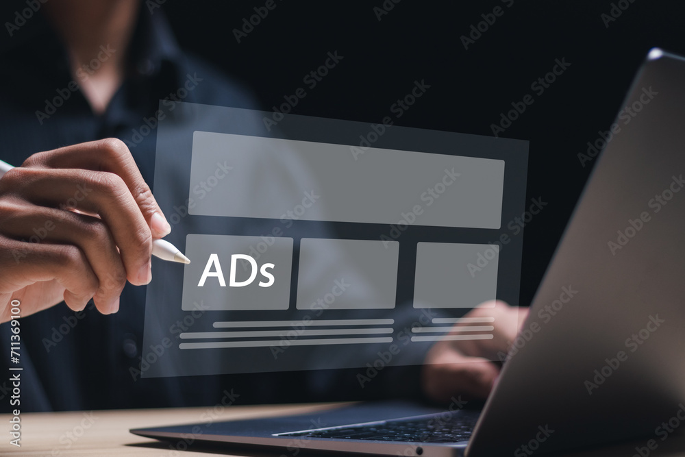 Wall mural online advertisement concept. person use laptop with virtual screen of advertisement for ad on websi