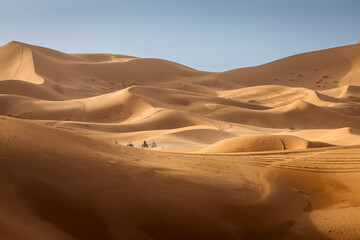 ATV machine running on desert dunes in Sahara, Merzouga, Morocco