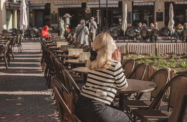 Vacation in France. Concept of tourism and holidays. Woman in city scene