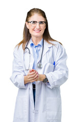 Middle age mature doctor woman wearing medical coat over isolated background Hands together and fingers crossed smiling relaxed and cheerful. Success and optimistic