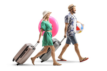Full length shot of a young couple tourists with suitcases going on a summer vacation