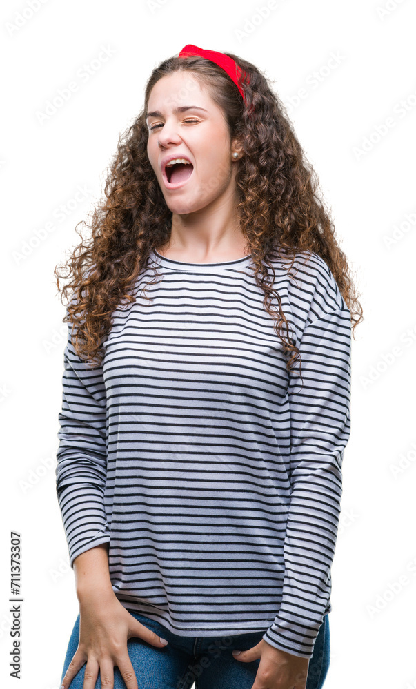 Sticker beautiful brunette curly hair young girl wearing stripes sweater over isolated background winking lo