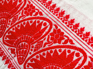 Gamosa or gamusa is a traditional textile pattern from Assam. It is a white piece of cloth with red stripes and red motifs, which is used in Bihu and resembles Ukrainian and Russian patterns.