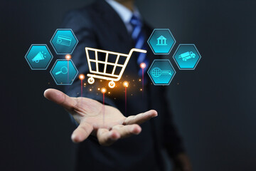 Digital marketing concept with businessman holding a shopping cart to promote online shopping...
