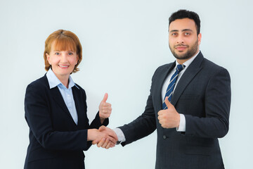 business man and business woman shaking hands in the office