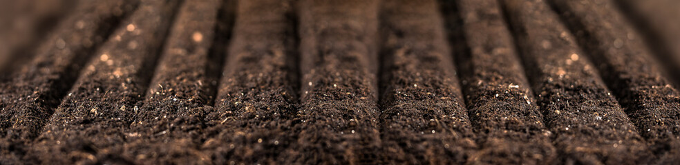Soil for plant. Freshly plowed field. Sowing season. Planting seeds soil ground
