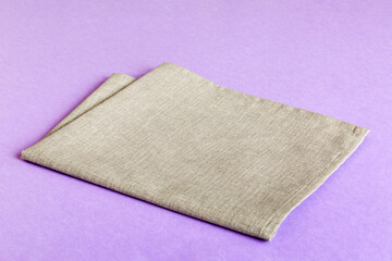 top view with gray kitchen napkin isolated on table background. Folded cloth for mockup with copy space, Flat lay. Minimal style