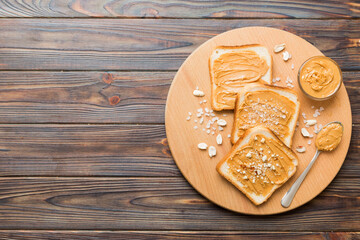 Peanut butter sandwiches or toasts on light table background.Breakfast. Vegetarian food. American cuisine top view vith copy space