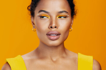 Creative woman portrait african colourful face make-up black smile yellow beauty