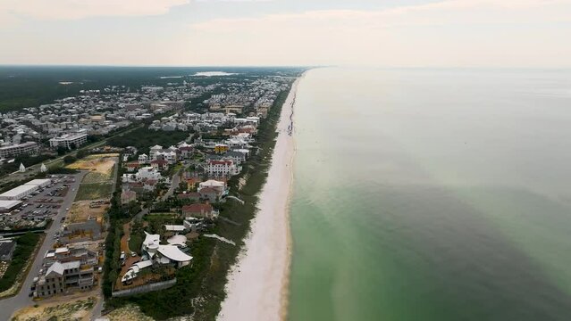 down to up motion
Sea side half water half land at Alys beach on daytime with white houses and buildings