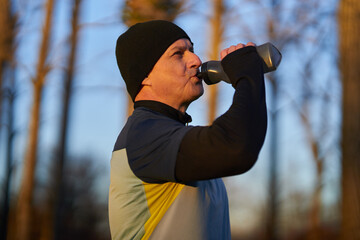 Runner drinking isotonic drink