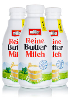 Pure buttermilk from Theo Müller company isolated on a white background portrait format