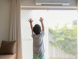 boy under air conditioner feeling relax at home	
