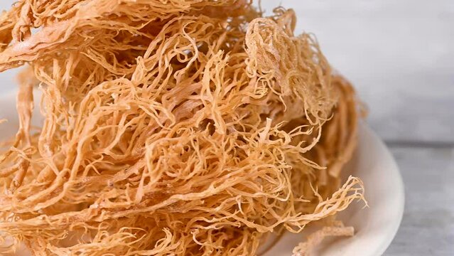 Sea Moss, closeup dried seaweed, used as food supplement.