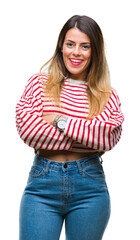Young beautiful woman casual stripes winter sweater over isolated background happy face smiling with crossed arms looking at the camera. Positive person.