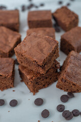 Chocolate frosted brownies on a ceramic plate