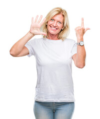 Fototapeta na wymiar Middle age blonde woman over isolated background showing and pointing up with fingers number seven while smiling confident and happy.