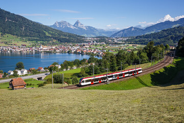 Passenger train type Stadler Flirt of Schweizerische Bundesbahnen SBB at Grosser Mythen mountain at...