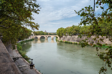 Beautiful view with Ponte Sisto (Sisto bridge) over Tiber River, with the Saint Peter's Basilica dome in the background in Rome, Italy.