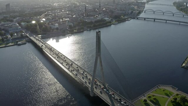 Aerial view of Riga old town, traffic on vansu bridge over Daugava river