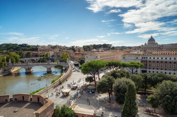 Fototapeta na wymiar Panoramic view of Rome Skyline with the famous Vatican St Peter Basilica and bridges above Tiber River in Rome, Italy. Aerial view from the terrace of Saint Angelo castle.