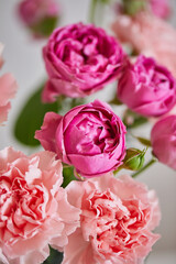 Bouquet of lilac roses and pink carnations. Close up