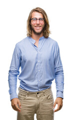 Fototapeta premium Young handsome man with long hair wearing glasses over isolated background with a happy and cool smile on face. Lucky person.