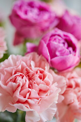 Bouquet of lilac roses and pink carnations. Close up
