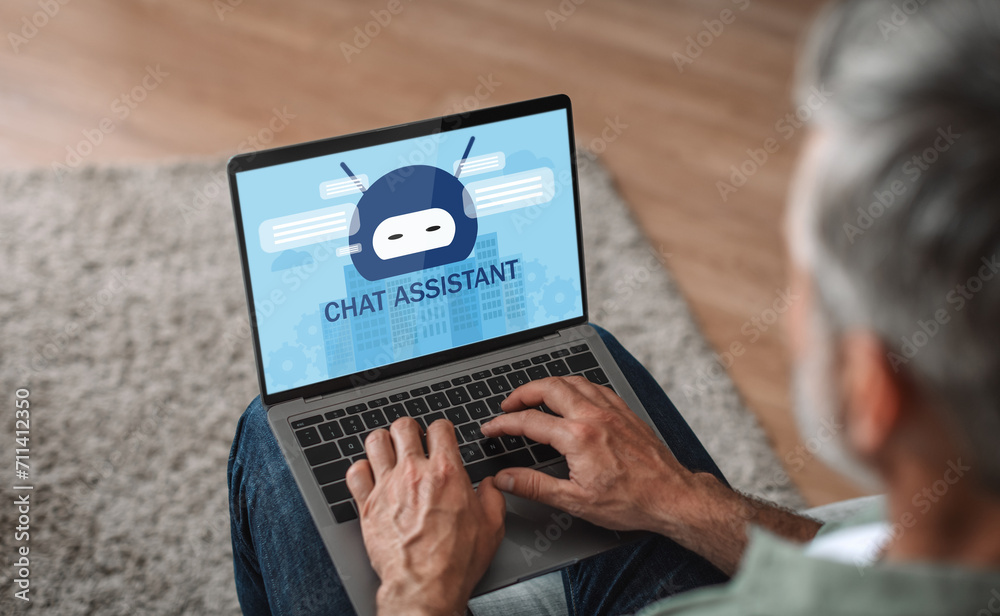 Poster unrecognizable relaxed mature man using chat assistant on laptop