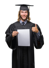 Young handsome graduate man with long hair holding blank paper over isolated background happy with big smile doing ok sign, thumb up with fingers, excellent sign