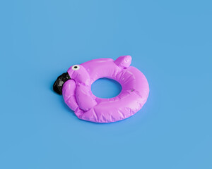 deflated pink flamingo pool float isolated against a solid blue background, summer preparation concept.