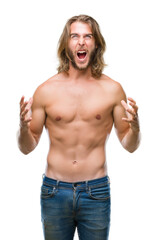 Young handsome shirtless man with long hair showing sexy body over isolated background crazy and mad shouting and yelling with aggressive expression and arms raised. Frustration concept.