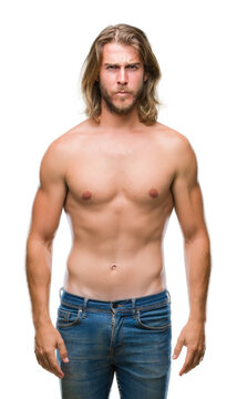 Young handsome shirtless man with long hair showing sexy body over isolated background skeptic and nervous, frowning upset because of problem. Negative person.