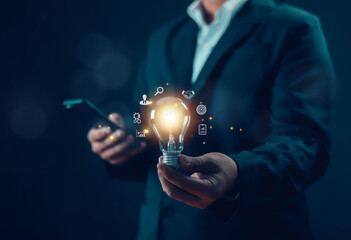 businessman holding a light bulb Innovative and inspirational concept, idea, brain, light bulb,...