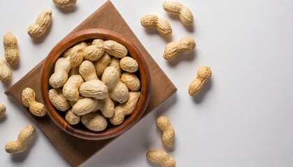 a modern and elegant visual with a top view of peanuts arranged artfully on a white background. Negative space is utilized to enhance the sophistication, making this image suitable for culinary blogs 